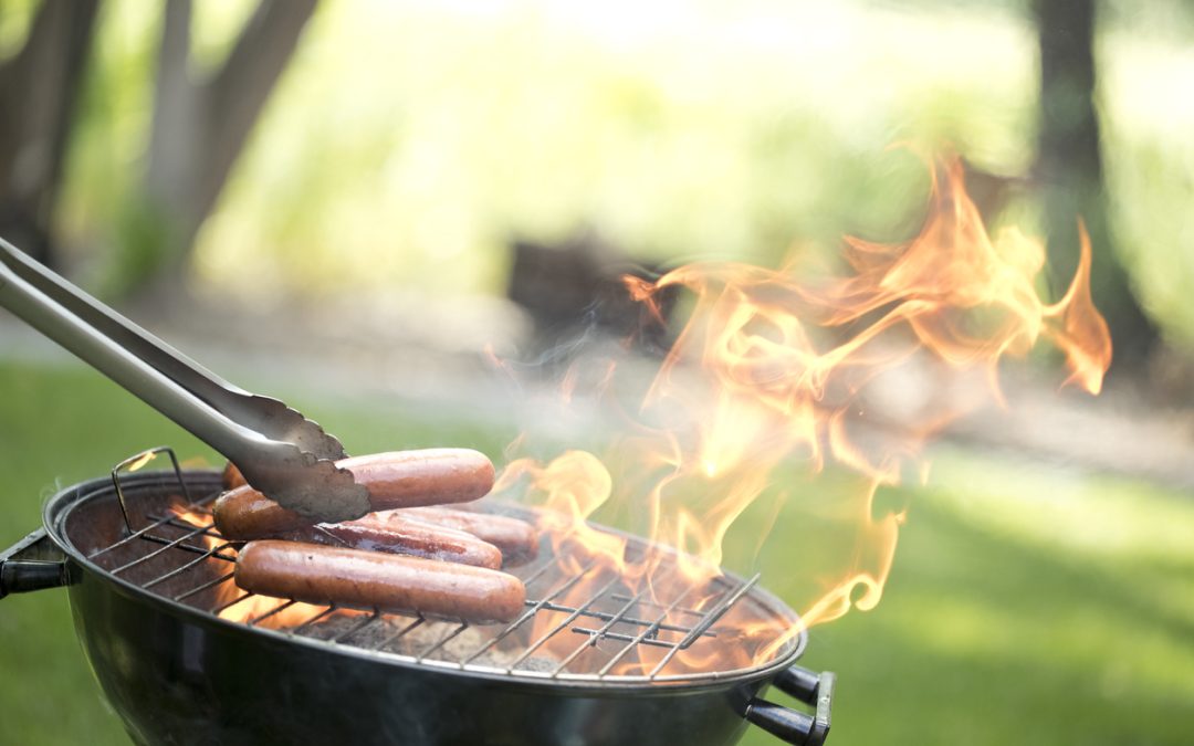 grilling-hotdogs-outdoors-during-cookout-season