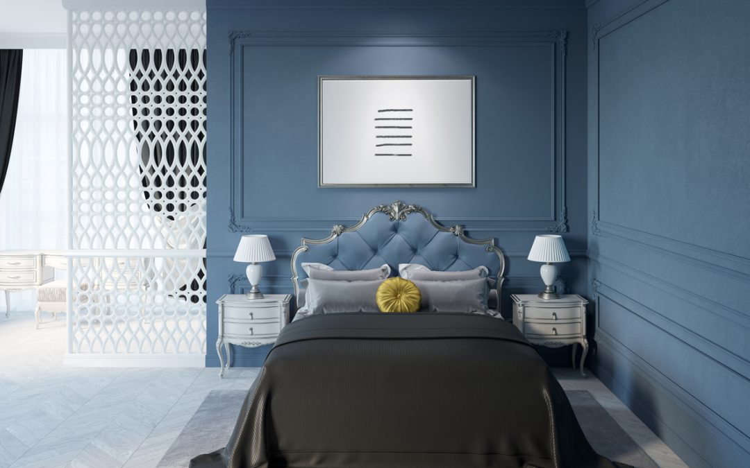 interior of a dark blue classic bedroom with accent wall