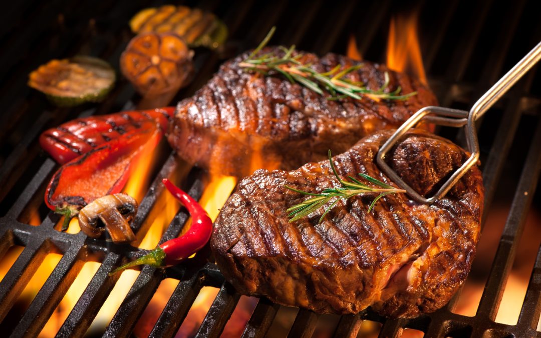 Beef steaks on direct heat grilling.