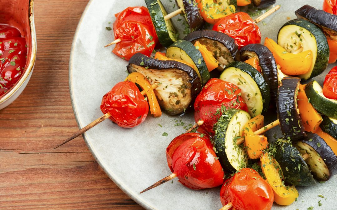 Vegetarian BBQ with peppers, eggplant, and cherry tomatoes.